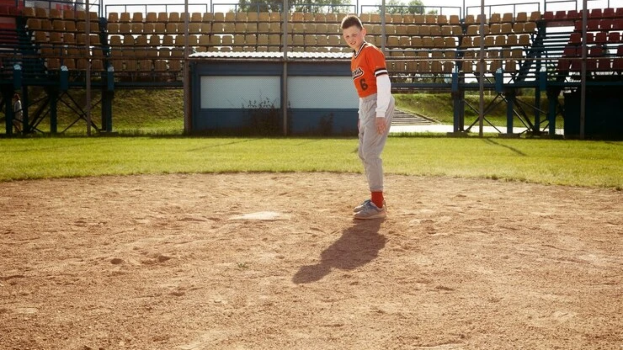 full-shot-kid-playing-kickball_23-2149457244