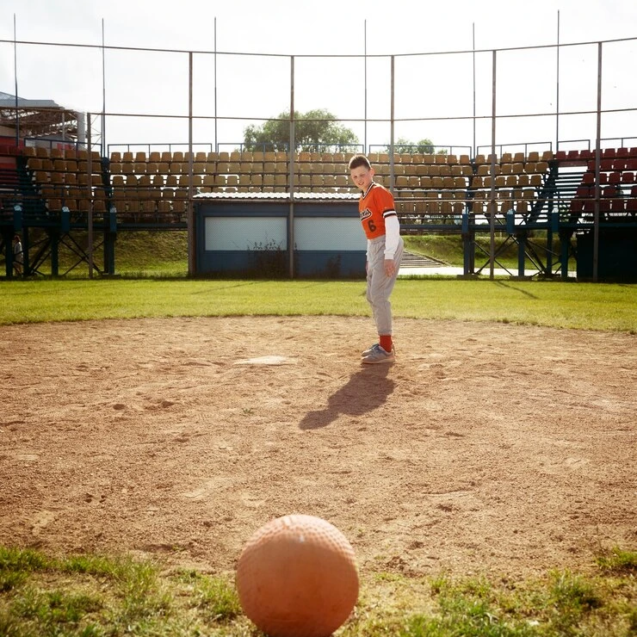 full-shot-kid-playing-kickball_23-2149457244