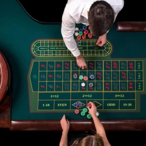man-croupier-woman-playing-roulette-table-casino-top-view-roulette-green-table-with-tape-measure_639032-2638.webp